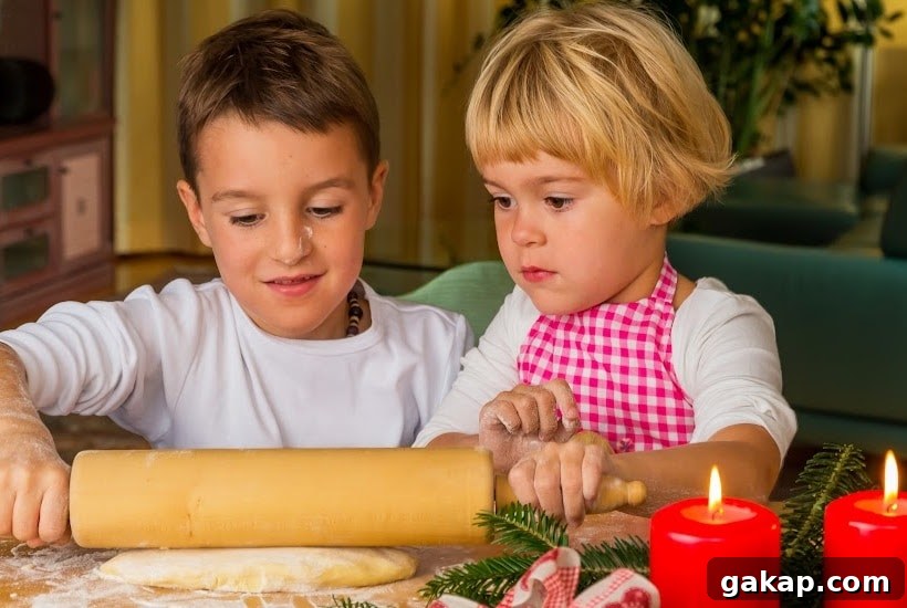 young boy and girl rolling out dough.