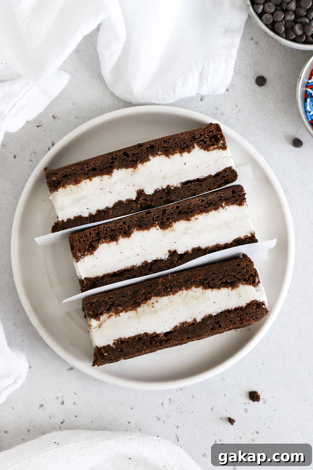 Gluten-Free Brownie Ice Cream Sandwich Recipe 5 Overhead view of three gluten free ice cream sandwiches on a plate