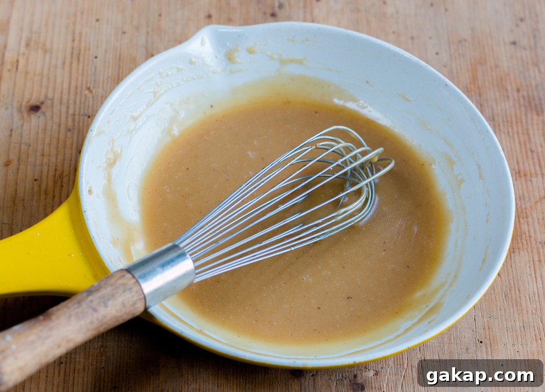 Brown butter caramel maple glaze in a small skillet