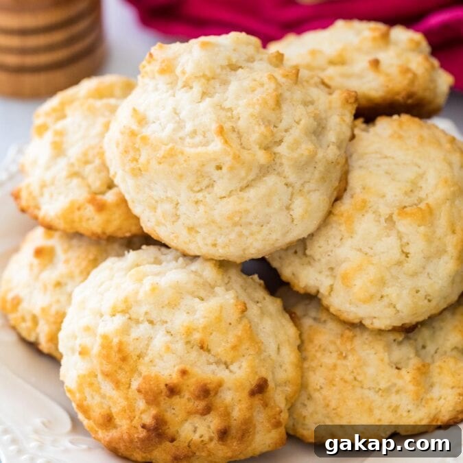 Homemade drop biscuits stacked in a pile