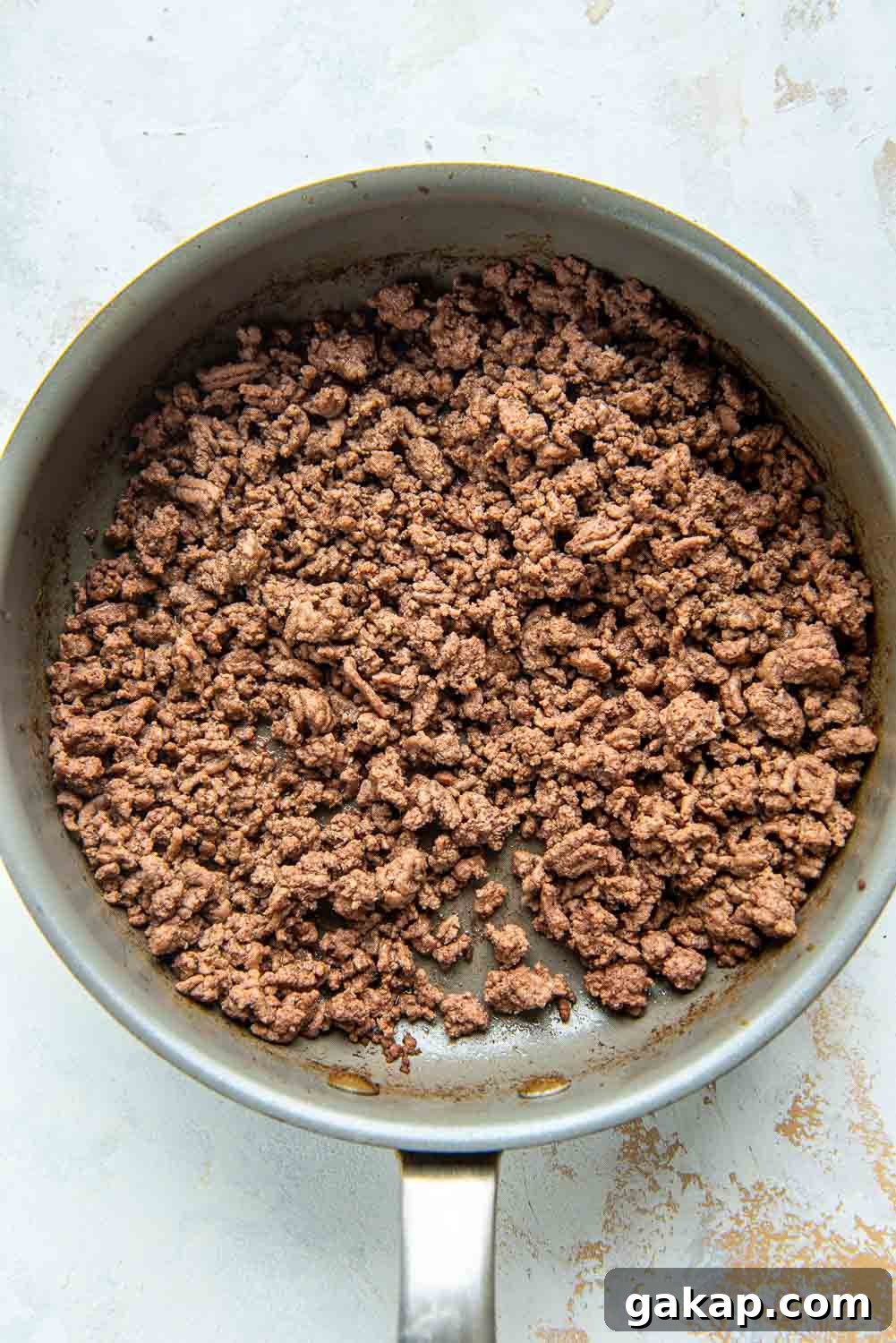 Ground hamburger meat on pan