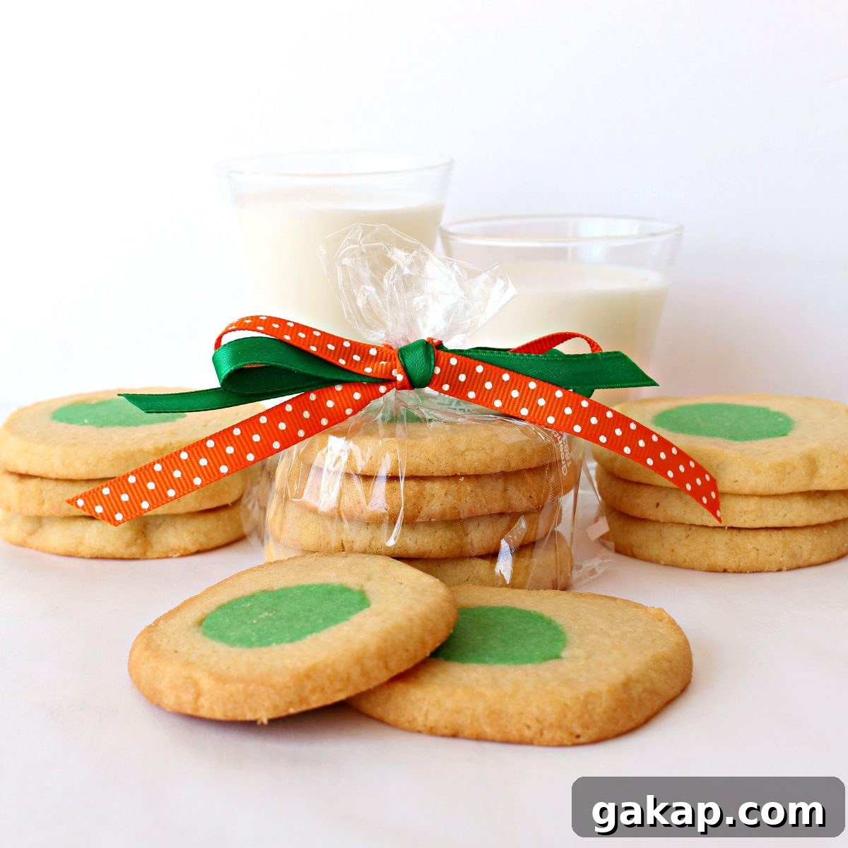 Green Eggs and Ham Sugar Cookies Inspired by Dr. Seuss 6 Green Eggs and Ham Cookies in a plastic bag tied with green and orange ribbon.