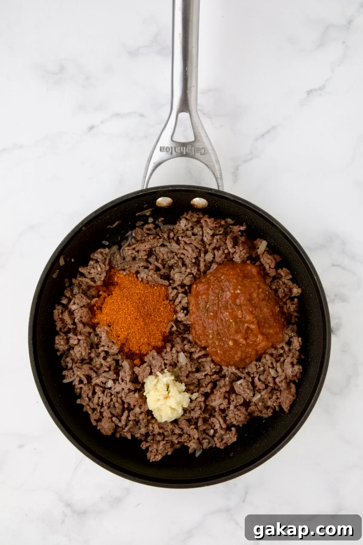 Mini Pepper Tacos: Flavor-Packed Taco-Stuffed Peppers 7 Cooked ground beef in nonstick skillet with taco seasoning and garlic added.