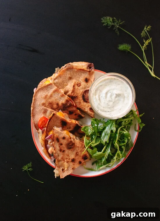 Tomato, olive and chickpea quesadilla with dill yogurt dip