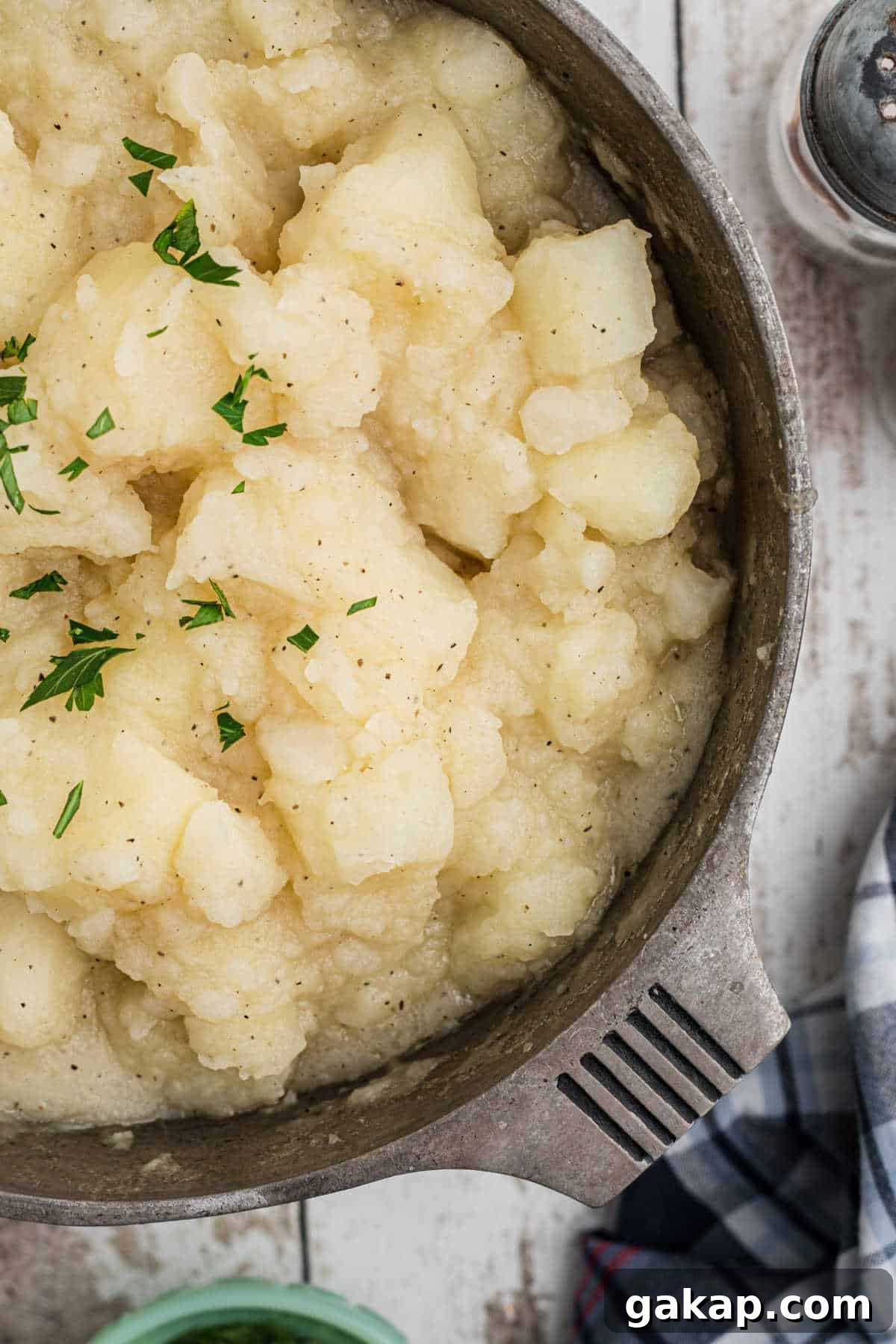 Comforting Stewed Potatoes Recipe with Garlic and Herbs 2 Overhead close up side shot of a pot of stewed potatoes.