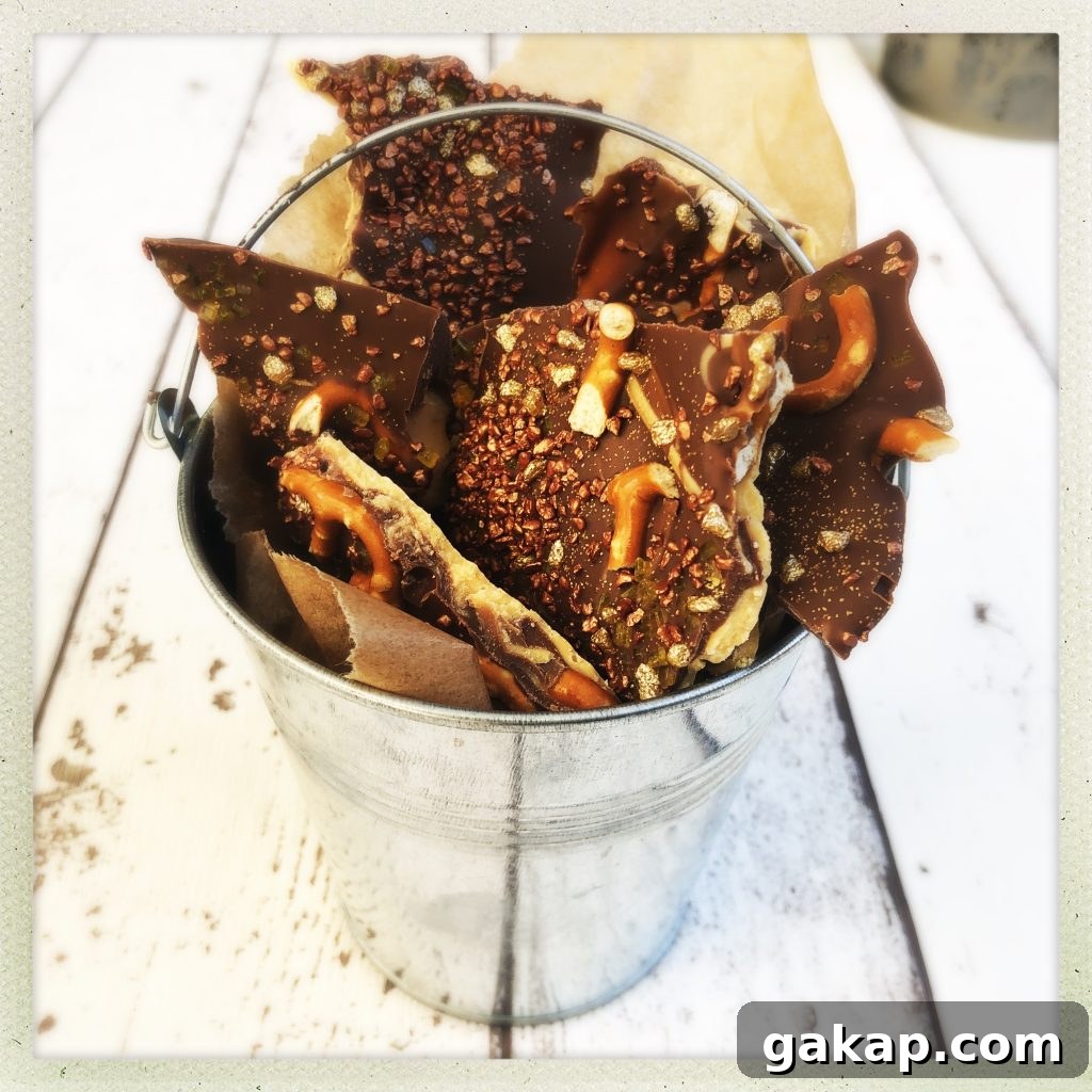 homemade chocolate bark for bonfire night, decorated with pretzels and edible glitter
