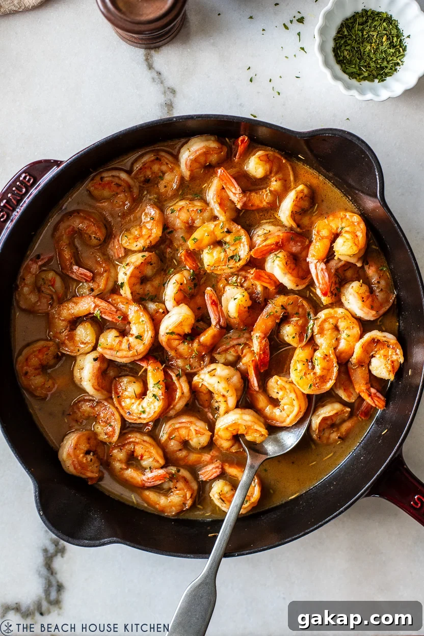 Overhead photo of a skillet of New Orleans-Style BBQ Shrimp
