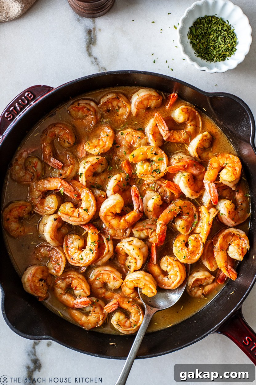 Overhead photo of a skillet of New Orleans-Style BBQ Shrimp