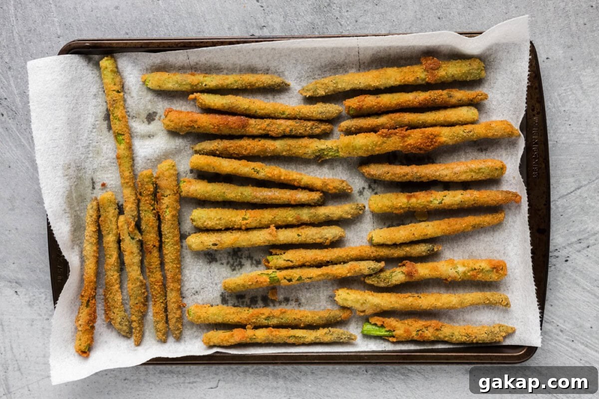 Crispy Pan-Fried Asparagus with Garlic and Lemon 12 fried asparagus draining on paper towels