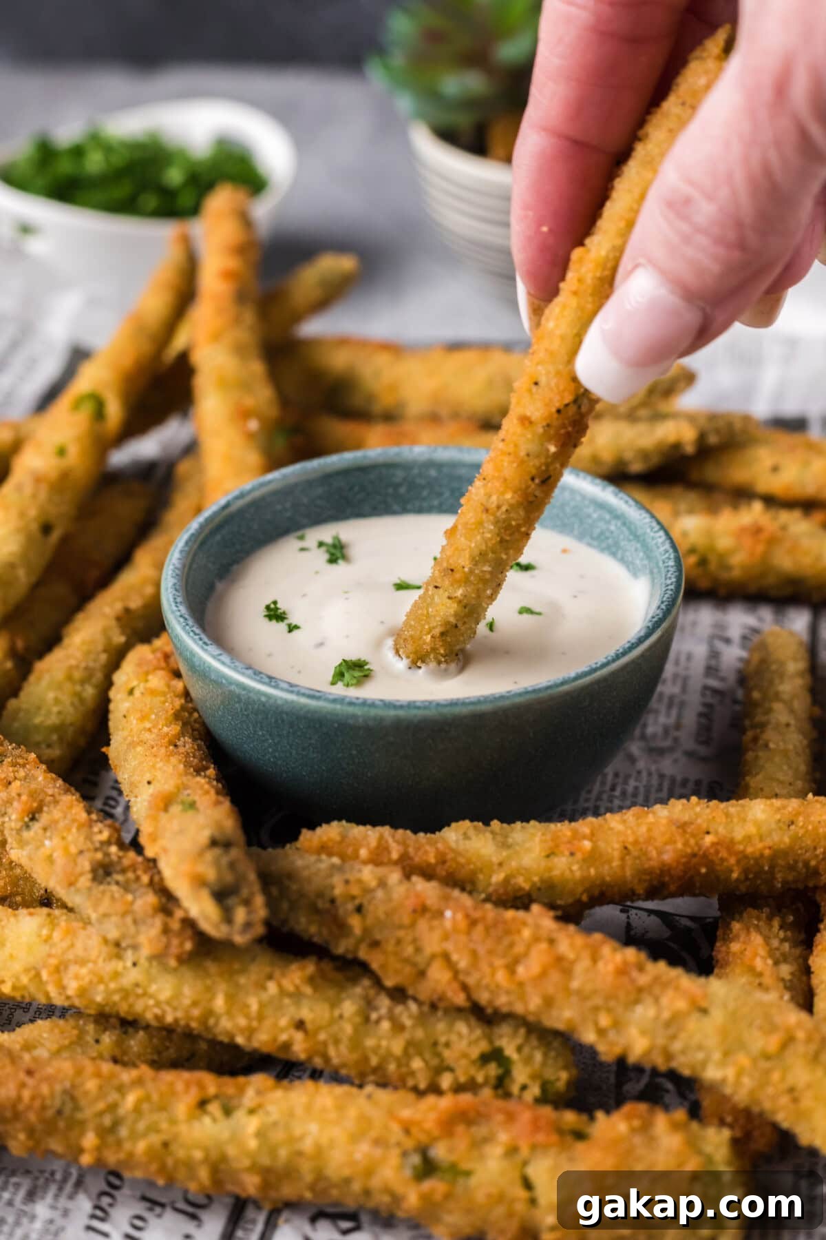 Crispy Pan-Fried Asparagus with Garlic and Lemon 13 Fried Asparagus being dipped into ranch