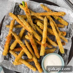 Crispy Pan-Fried Asparagus with Garlic and Lemon 14 Fried Asparagus on a platter with a bowl of ranch