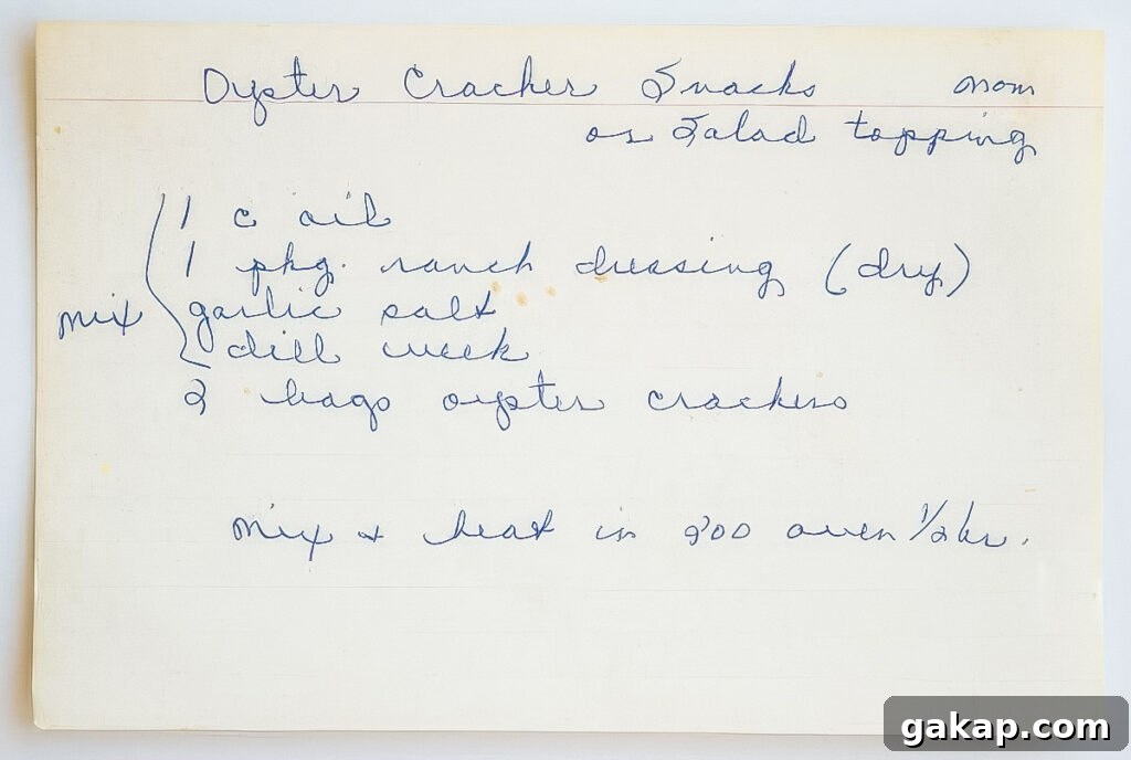 Vintage handwritten recipe card for ranch oyster crackers with oil, ranch dressing mix, garlic salt, and dill weed, labeled "mom" in the corner.