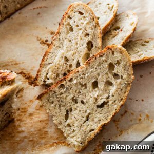 Slices of rustic Italian bread on cutting board.