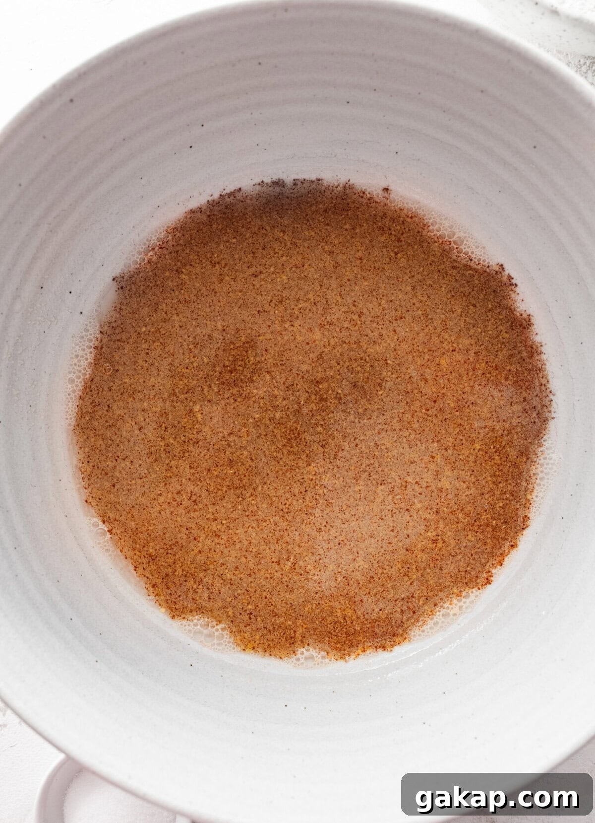 Yeast and water in a bowl. 