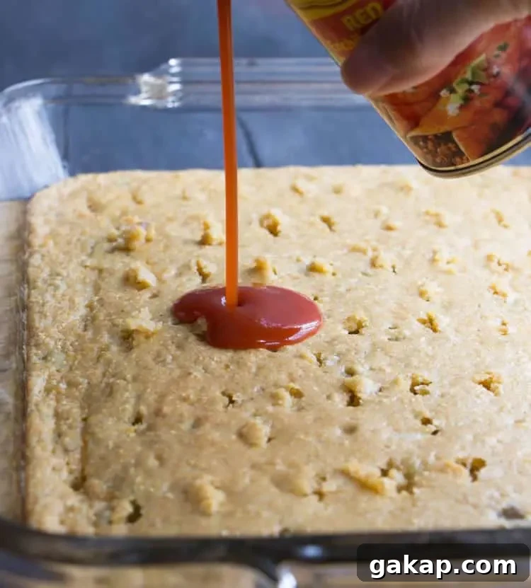 Easy Chicken Tamale Casserole. A layer of moist, savory cornbread is topped with chicken, enchilada sauce and cheese.