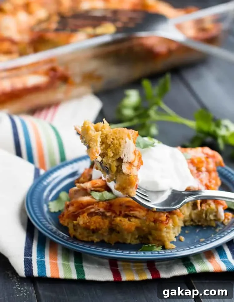 Easy Chicken Tamale Casserole. A layer of moist, savory cornbread is topped with chicken, enchilada sauce and cheese.
