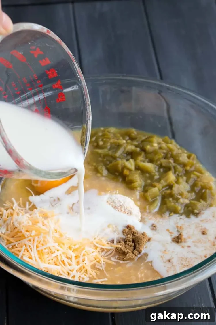 Easy Chicken Tamale Casserole. A layer of moist, savory cornbread is topped with chicken, enchilada sauce and cheese.