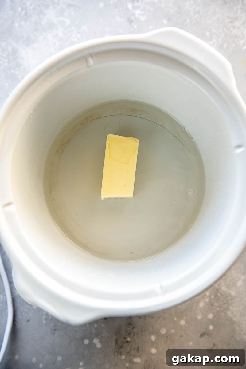water and stick of butter in slow cooker