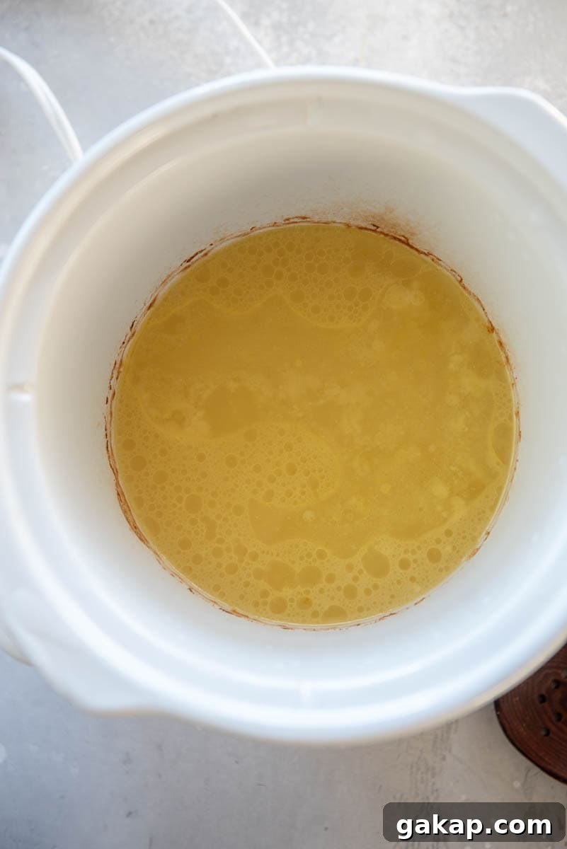 hot water and melted butter in slow cooker