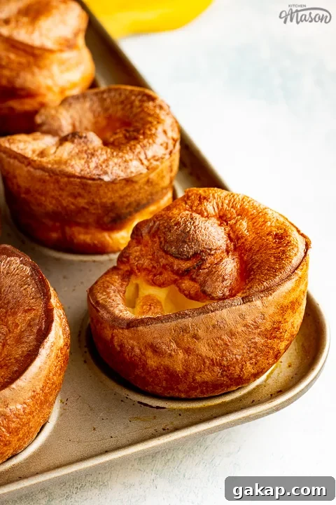 Yorkshire puddings in a pan with a yellow napkin