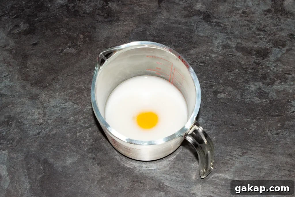 Egg, milk and water in a glass jug