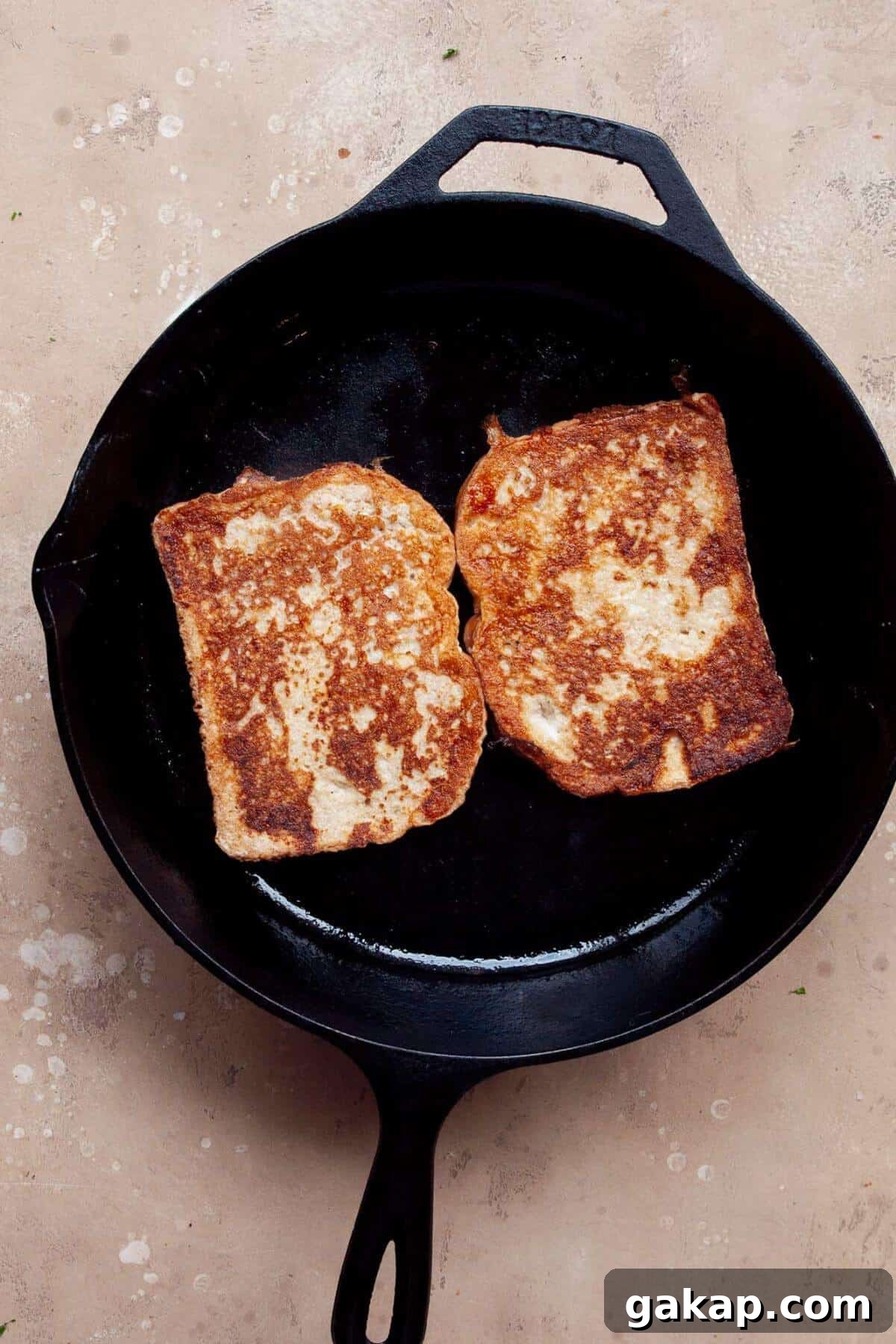 Cooking protein french toast in a skillet.