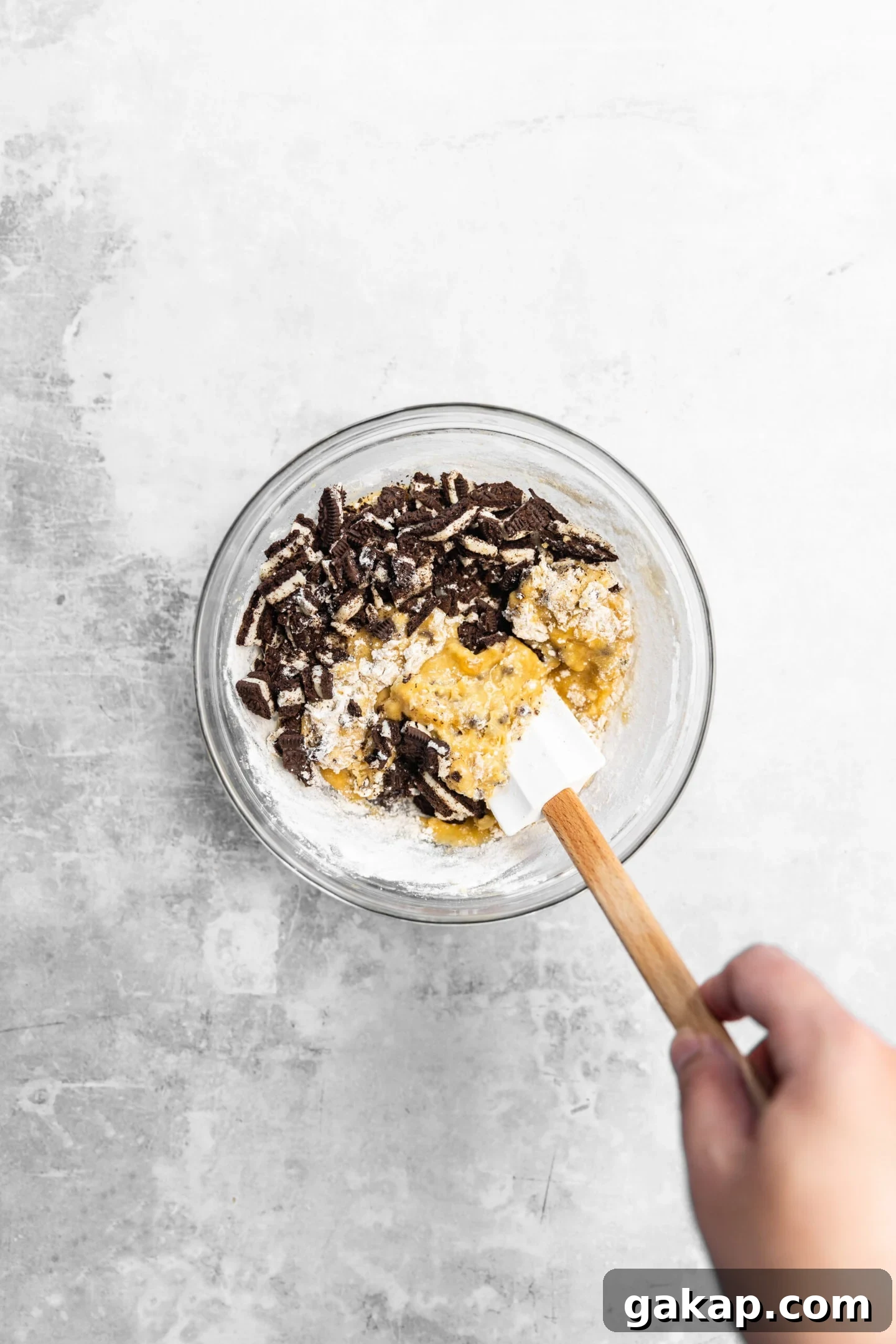 Oreos being folded into blondie batter.