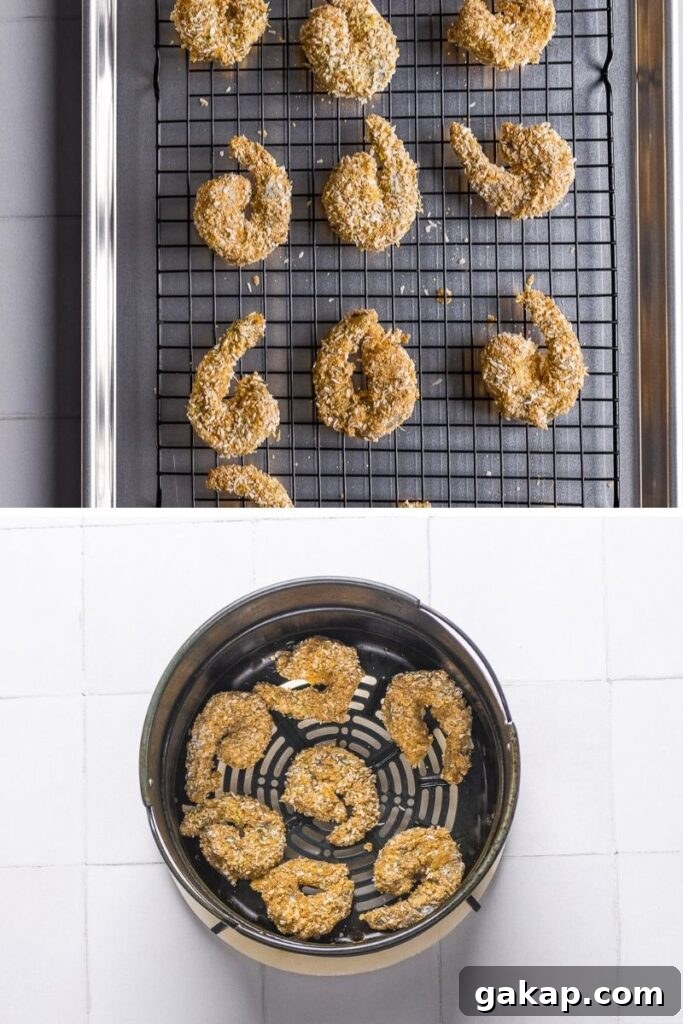 breaded coconut airfryer shrimp in an air fryer about to be baked