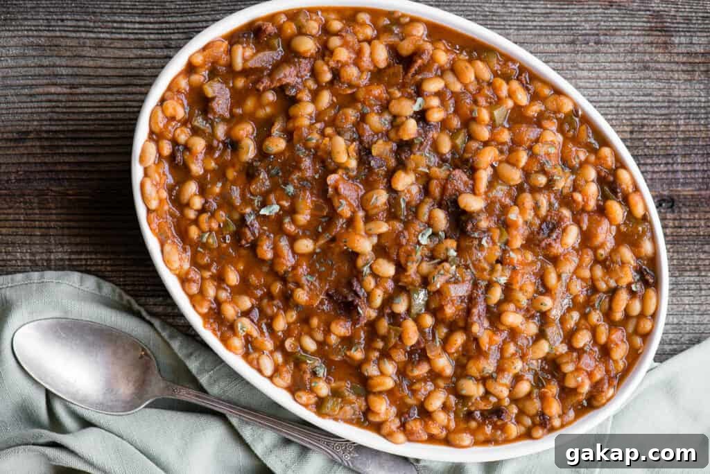oval dish of bacon baked beans